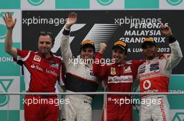 Stefano Domenicali (ITA) Ferrari General Director with 2nd place Sergio Perez (MEX), Sauber F1 Team and 1st place Fernando Alonso (ESP), Scuderia Ferrari and 3rd place Lewis Hamilton (GBR), McLaren Mercedes  25.03.2012. Formula 1 World Championship, Rd 2, Malaysian Grand Prix, Sepang, Malaysia, Sunday Podium