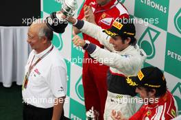 Sergio Perez (MEX) Sauber celebrates his second position on the podium. 25.03.2012. Formula 1 World Championship, Rd 2, Malaysian Grand Prix, Sepang, Malaysia, Sunday Podium