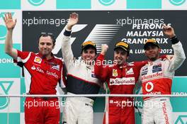 The podium (L to R): Stefano Domenicali (ITA) Ferrari General Director with second placed Sergio Perez (MEX) Sauber; race winner Fernando Alonso (ESP) Ferrari; third placed Lewis Hamilton (GBR) McLaren. 25.03.2012. Formula 1 World Championship, Rd 2, Malaysian Grand Prix, Sepang, Malaysia, Sunday Podium