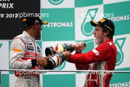 Lewis Hamilton (GBR), McLaren Mercedes and Fernando Alonso (ESP), Scuderia Ferrari  25.03.2012. Formula 1 World Championship, Rd 2, Malaysian Grand Prix, Sepang, Malaysia, Sunday Podium