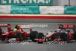 (L to R): Felipe Massa (BRA) Ferrari F2012 and Jenson Button (GBR) McLaren MP4/27 battle for position. 25.03.2012. Formula 1 World Championship, Rd 2, Malaysian Grand Prix, Sepang, Malaysia, Sunday Race