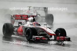 Jenson Button (GBR) McLaren MP4/27 leads second placed Sergio Perez (MEX) Sauber C31. 25.03.2012. Formula 1 World Championship, Rd 2, Malaysian Grand Prix, Sepang, Malaysia, Sunday Race
