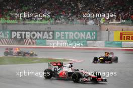 Jenson Button (GBR) McLaren MP4/27 leads Mark Webber (AUS) Red Bull Racing RB8 and Sebastian Vettel (GER) Red Bull Racing RB8. 25.03.2012. Formula 1 World Championship, Rd 2, Malaysian Grand Prix, Sepang, Malaysia, Sunday Race