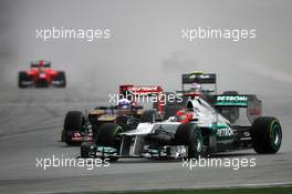 Michael Schumacher (GER) Mercedes AMG F1 W03 leads Daniel Ricciardo (AUS) Scuderia Toro Rosso STR7. 25.03.2012. Formula 1 World Championship, Rd 2, Malaysian Grand Prix, Sepang, Malaysia, Sunday Race