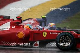 Fernando Alonso (ESP) Ferrari F2012 and Jean-Eric Vergne (FRA) Scuderia Toro Rosso STR7. 25.03.2012. Formula 1 World Championship, Rd 2, Malaysian Grand Prix, Sepang, Malaysia, Sunday Race
