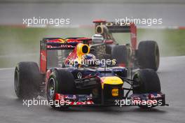 Sebastian Vettel (GER) Red Bull Racing RB8 leads Kimi Raikkonen (FIN) Lotus E20. 25.03.2012. Formula 1 World Championship, Rd 2, Malaysian Grand Prix, Sepang, Malaysia, Sunday Race