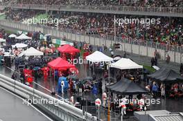 Cars on the grid as the race is stopped during a thunderstorm. 25.03.2012. Formula 1 World Championship, Rd 2, Malaysian Grand Prix, Sepang, Malaysia, Sunday Race