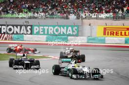 Nico Rosberg (GER) Mercedes AMG F1 W03 leads Pastor Maldonado (VEN) Williams FW34. 25.03.2012. Formula 1 World Championship, Rd 2, Malaysian Grand Prix, Sepang, Malaysia, Sunday Race