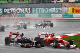 (L to R): Daniel Ricciardo (AUS) Scuderia Toro Rosso STR7 and Felipe Massa (BRA) Ferrari F2012 battle for position. 25.03.2012. Formula 1 World Championship, Rd 2, Malaysian Grand Prix, Sepang, Malaysia, Sunday Race