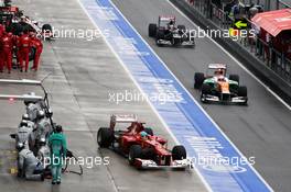 Fernando Alonso (ESP) Ferrari F2012 pulls out of the pits ahead of Paul di Resta (GBR) Sahara Force India VJM05. 25.03.2012. Formula 1 World Championship, Rd 2, Malaysian Grand Prix, Sepang, Malaysia, Sunday Race