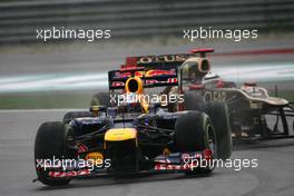 Sebastian Vettel (GER), Red Bull Racing and Kimi Raikkonen (FIN), Lotus F1 Team  25.03.2012. Formula 1 World Championship, Rd 2, Malaysian Grand Prix, Sepang, Malaysia, Sunday Race