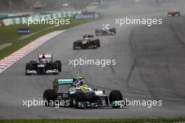 Nico Rosberg (GER) Mercedes AMG F1 W03 leads Pastor Maldonado (VEN) Williams FW34. 25.03.2012. Formula 1 World Championship, Rd 2, Malaysian Grand Prix, Sepang, Malaysia, Sunday Race
