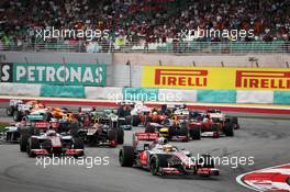 Lewis Hamilton (GBR) McLaren leads at the start of the race. 25.03.2012. Formula 1 World Championship, Rd 2, Malaysian Grand Prix, Sepang, Malaysia, Sunday Race