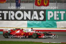 (L to R): Felipe Massa (BRA) Ferrari F2012 and Jenson Button (GBR) McLaren MP4/27 battle for position. 25.03.2012. Formula 1 World Championship, Rd 2, Malaysian Grand Prix, Sepang, Malaysia, Sunday Race