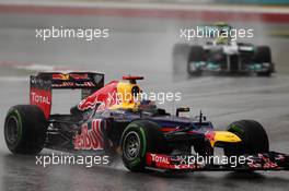 Sebastian Vettel (GER) Red Bull Racing RB8 leads Nico Rosberg (GER) Mercedes AMG F1 W03. 25.03.2012. Formula 1 World Championship, Rd 2, Malaysian Grand Prix, Sepang, Malaysia, Sunday Race