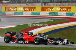 Bruno Senna (BRA) Williams FW34 leads Timo Glock (GER) Marussia F1 Team MR01. 25.03.2012. Formula 1 World Championship, Rd 2, Malaysian Grand Prix, Sepang, Malaysia, Sunday Race