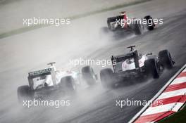 (L to R): Michael Schumacher (GER) Mercedes AMG F1 W03 and Pastor Maldonado (VEN) Williams FW34 battle for position. 25.03.2012. Formula 1 World Championship, Rd 2, Malaysian Grand Prix, Sepang, Malaysia, Sunday Race