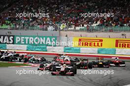 Lewis Hamilton (GBR) McLaren MP4/27 leads at the start of the race. 25.03.2012. Formula 1 World Championship, Rd 2, Malaysian Grand Prix, Sepang, Malaysia, Sunday Race