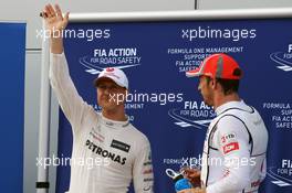(L to R): Lewis Hamilton (GBR) McLaren celebrates his second position in parc ferme with third placed Jenson Button (GBR) McLaren. 24.03.2012. Formula 1 World Championship, Rd 2, Malaysian Grand Prix, Sepang, Malaysia, Saturday Qualifying