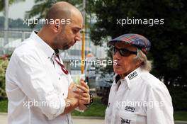 (L to R): Eric Lux (BEL) Genii Capital CEO with Jackie Stewart (GBR). 24.03.2012. Formula 1 World Championship, Rd 2, Malaysian Grand Prix, Sepang, Malaysia, Saturday