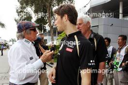 (L to R): Jackie Stewart (GBR) with Romain Grosjean (FRA) Lotus F1 Team. 24.03.2012. Formula 1 World Championship, Rd 2, Malaysian Grand Prix, Sepang, Malaysia, Saturday