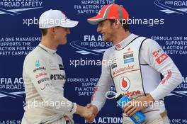Qualifying results (L-R) 3rd Michael Schumacher (GER), Mercedes AMG Petronas and 2nd place Jenson Button (GBR), McLaren Mercedes shake hands  24.03.2012. Formula 1 World Championship, Rd 2, Malaysian Grand Prix, Sepang, Malaysia, Saturday Qualifying