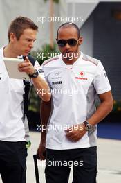 (L to R): Adam Costenzo (GBR) Personal Trainer with Lewis Hamilton (GBR) McLaren. 24.03.2012. Formula 1 World Championship, Rd 2, Malaysian Grand Prix, Sepang, Malaysia, Saturday