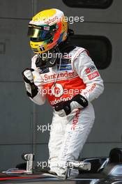 Lewis Hamilton (GBR) McLaren celebrates his pole position in parc ferme. 24.03.2012. Formula 1 World Championship, Rd 2, Malaysian Grand Prix, Sepang, Malaysia, Saturday Qualifying