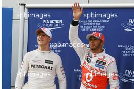 Lewis Hamilton (GBR) McLaren celebrates his pole position with second placed Lewis Hamilton (GBR) McLaren (Left). 24.03.2012. Formula 1 World Championship, Rd 2, Malaysian Grand Prix, Sepang, Malaysia, Saturday Qualifying