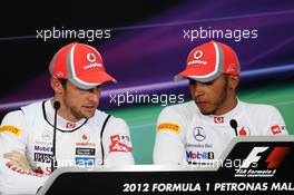 (L to R): Jenson Button (GBR) McLaren with team mate and pole sitter Lewis Hamilton (GBR) McLaren in the FIA Press Conference. 24.03.2012. Formula 1 World Championship, Rd 2, Malaysian Grand Prix, Sepang, Malaysia, Saturday Qualifying
