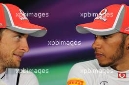 (L to R): Jenson Button (GBR) McLaren with team mate Lewis Hamilton (GBR) McLaren in the FIA Press Conference. 24.03.2012. Formula 1 World Championship, Rd 2, Malaysian Grand Prix, Sepang, Malaysia, Saturday Qualifying