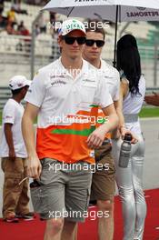 (L to R): Nico Hulkenberg (GER) Sahara Force India F1 and Paul di Resta (GBR) Sahara Force India F1 on the drivers parade. 25.03.2012. Formula 1 World Championship, Rd 2, Malaysian Grand Prix, Sepang, Malaysia, Sunday