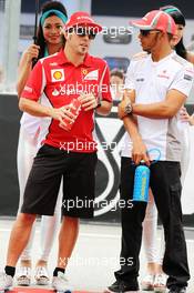 (L to R): Fernando Alonso (ESP) Ferrari and Lewis Hamilton (GBR) McLaren on the drivers parade. 25.03.2012. Formula 1 World Championship, Rd 2, Malaysian Grand Prix, Sepang, Malaysia, Sunday