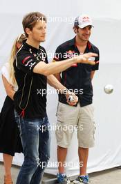 (L to R): Romain Grosjean (FRA) Lotus F1 Team and Jean-Eric Vergne (FRA) Scuderia Toro Rosso play boules. 22.03.2012. Formula 1 World Championship, Rd 2, Malaysian Grand Prix, Sepang, Malaysia, Thursday