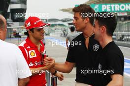 Felipe Massa (BRA) Ferrari shakes hands with GP2 Driver Stefano Coletti (ITA) Scuderia Coloni. 22.03.2012. Formula 1 World Championship, Rd 2, Malaysian Grand Prix, Sepang, Malaysia, Thursday