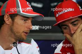 (L to R): Jenson Button (GBR) McLaren and Fernando Alonso (ESP) Ferrari in the FIA Press Conference. 22.03.2012. Formula 1 World Championship, Rd 2, Malaysian Grand Prix, Sepang, Malaysia, Thursday