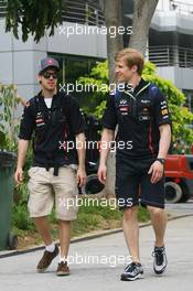 (L to R): Sebastian Vettel (GER) Red Bull Racing with his Personal Trainer Heikki Huovinen (FIN). 22.03.2012. Formula 1 World Championship, Rd 2, Malaysian Grand Prix, Sepang, Malaysia, Thursday