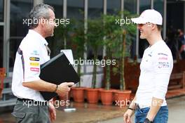 (L to R): Beat Zehnder (SUI) Sauber F1 Team Manager with Michael Schumacher (GER) Mercedes AMG F1. 22.03.2012. Formula 1 World Championship, Rd 2, Malaysian Grand Prix, Sepang, Malaysia, Thursday