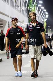 (L to R): Timo Glock (GER) Marussia F1 Team with Jean-Eric Vergne (FRA) Scuderia Toro Rosso. 21.09.2012.Formula 1 World Championship, Rd 14, Singapore Grand Prix, Singapore, Singapore, Practice Day