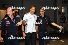 (L to R): Jenson Button (GBR) McLaren and Sebastian Vettel (GER) Red Bull Racing leave the Stewards office after the race. 23.09.2012. Formula 1 World Championship, Rd 14, Singapore Grand Prix, Singapore, Singapore, Race Day