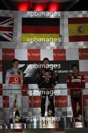 1st place Sebastian Vettel (GER), Red Bull Racing with 2nd place Jenson Button (GBR), McLaren Mercedes and 3rd place Fernando Alonso (ESP), Scuderia Ferrari  23.09.2012. Formula 1 World Championship, Rd 14, Singapore Grand Prix, Singapore, Singapore, Race Day