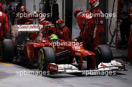 Felipe Massa (BRA) Ferrari F2012 makes a pit stop. 23.09.2012. Formula 1 World Championship, Rd 14, Singapore Grand Prix, Singapore, Singapore, Race Day