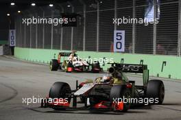 Narain Karthikeyan (IND) HRT Formula One Team HRT F112 leads team mate Pedro De La Rosa (ESP) HRT Formula 1 Team F112. 23.09.2012. Formula 1 World Championship, Rd 14, Singapore Grand Prix, Singapore, Singapore, Race Day