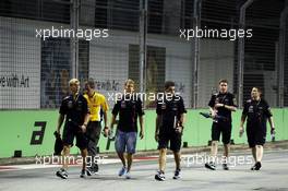 Sebastian Vettel (GER) Red Bull Racing walks the circuit with Heikki Huovinen (FIN) Personal Trainer (Left) and Guillaume Rocquelin  (ITA) Red Bull Racing Race Engineer (Right). 20.09.2012. Formula 1 World Championship, Rd 14, Singapore Grand Prix, Singapore, Singapore, Preparation Day