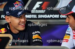 (L to R): Sebastian Vettel (GER) Red Bull Racing and Sergio Perez (MEX) Sauber in the FIA Press Conference. 20.09.2012. Formula 1 World Championship, Rd 14, Singapore Grand Prix, Singapore, Singapore, Preparation Day
