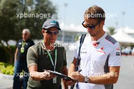 Jenson Button (GBR) McLaren signs autographs for the fans. 02.11.2012. Formula 1 World Championship, Rd 18, Abu Dhabi Grand Prix, Yas Marina Circuit, Abu Dhabi, Practice Day.