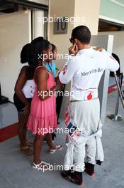 Lewis Hamilton (GBR) McLaren with guests. 02.11.2012. Formula 1 World Championship, Rd 18, Abu Dhabi Grand Prix, Yas Marina Circuit, Abu Dhabi, Practice Day.