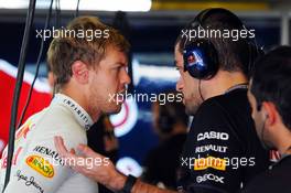 (L to R): Sebastian Vettel (GER) Red Bull Racing with Guillaume Rocquelin  (ITA) Red Bull Racing Race Engineer. 02.11.2012. Formula 1 World Championship, Rd 18, Abu Dhabi Grand Prix, Yas Marina Circuit, Abu Dhabi, Practice Day.