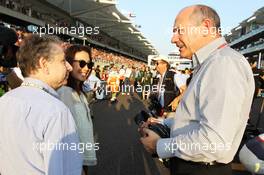 Jean Todt (FRA) FIA President and Michelle Yeoh (MAL)  with Ron Dennis (GBR) McLaren Executive Chairman on the grid. 04.11.2012. Formula 1 World Championship, Rd 18, Abu Dhabi Grand Prix, Yas Marina Circuit, Abu Dhabi, Race Day.