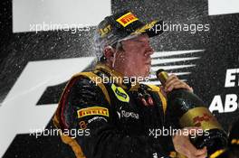 Race winner Kimi Raikkonen (FIN) Lotus F1 Team celebrates on the podium. 04.11.2012. Formula 1 World Championship, Rd 18, Abu Dhabi Grand Prix, Yas Marina Circuit, Abu Dhabi, Race Day.